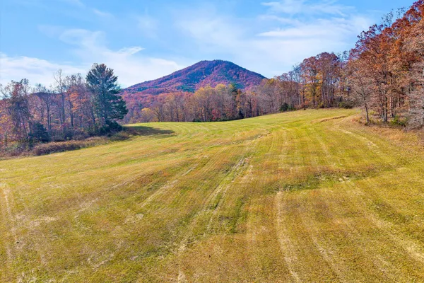 a view of a swimming pool with an outdoor space and seating area
