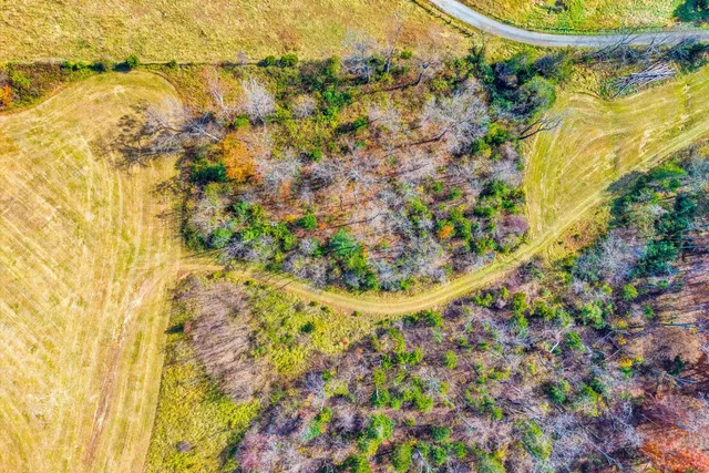a view of swimming pool with seating area and mountain view