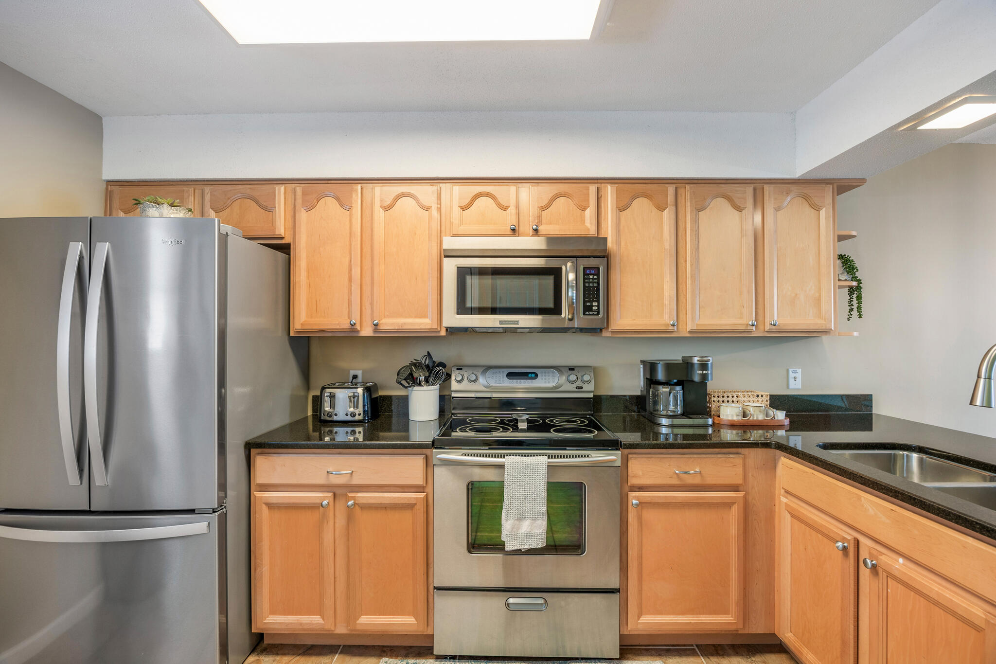 11 Driftwood Road, Unit 2 Miramar Beach, FL 32550 - Photo 13 of 45 a kitchen with granite countertop a refrigerator stove top oven and sink