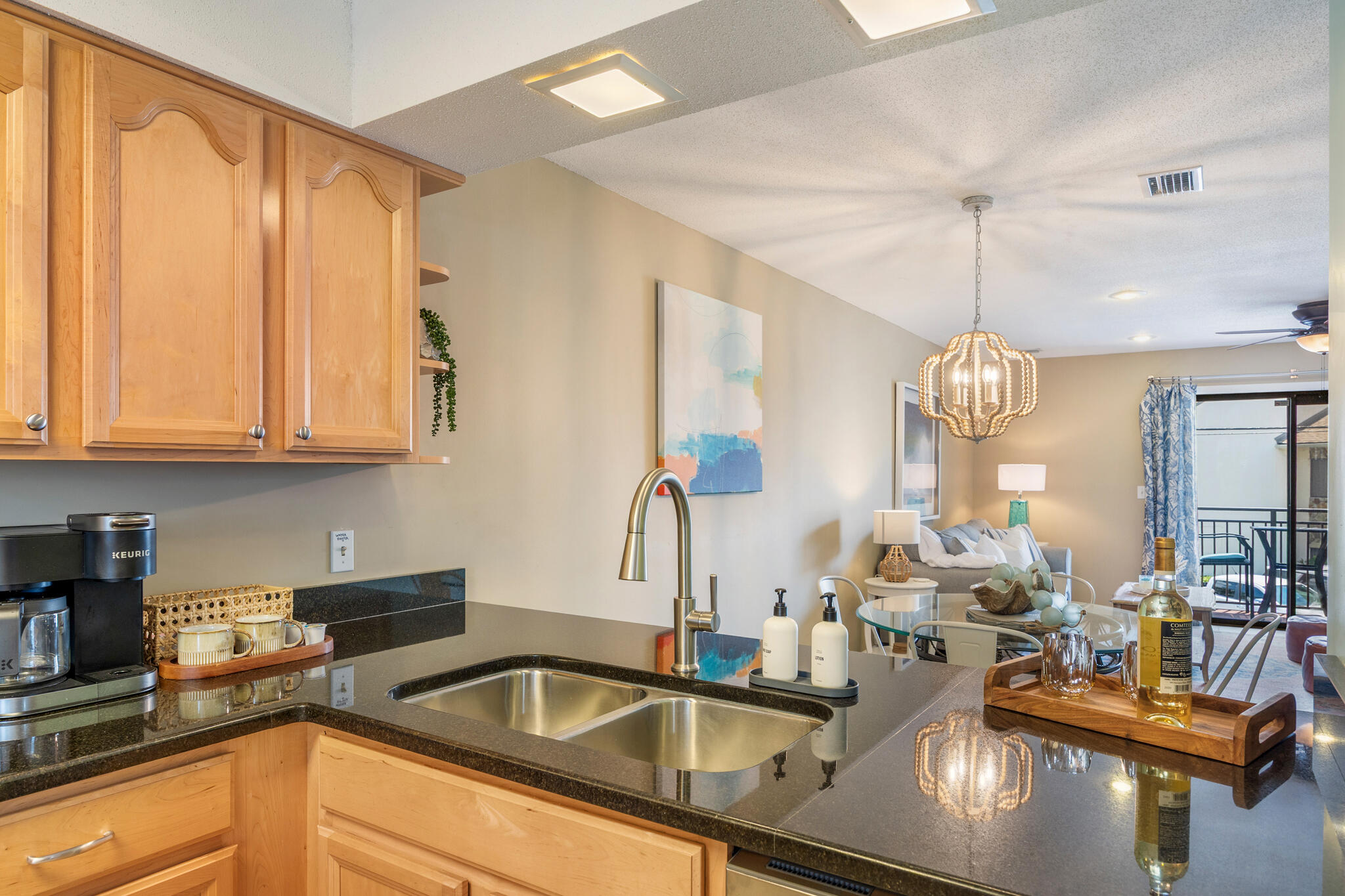 11 Driftwood Road, Unit 2 Miramar Beach, FL 32550 - Photo 15 of 45 a kitchen with sink a faucet and chairs