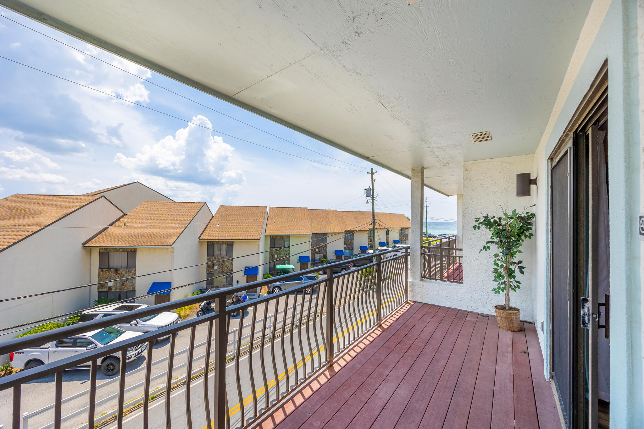 11 Driftwood Road, Unit 2 Miramar Beach, FL 32550 - Photo 22 of 45 a view of a balcony with chairs and wooden floor