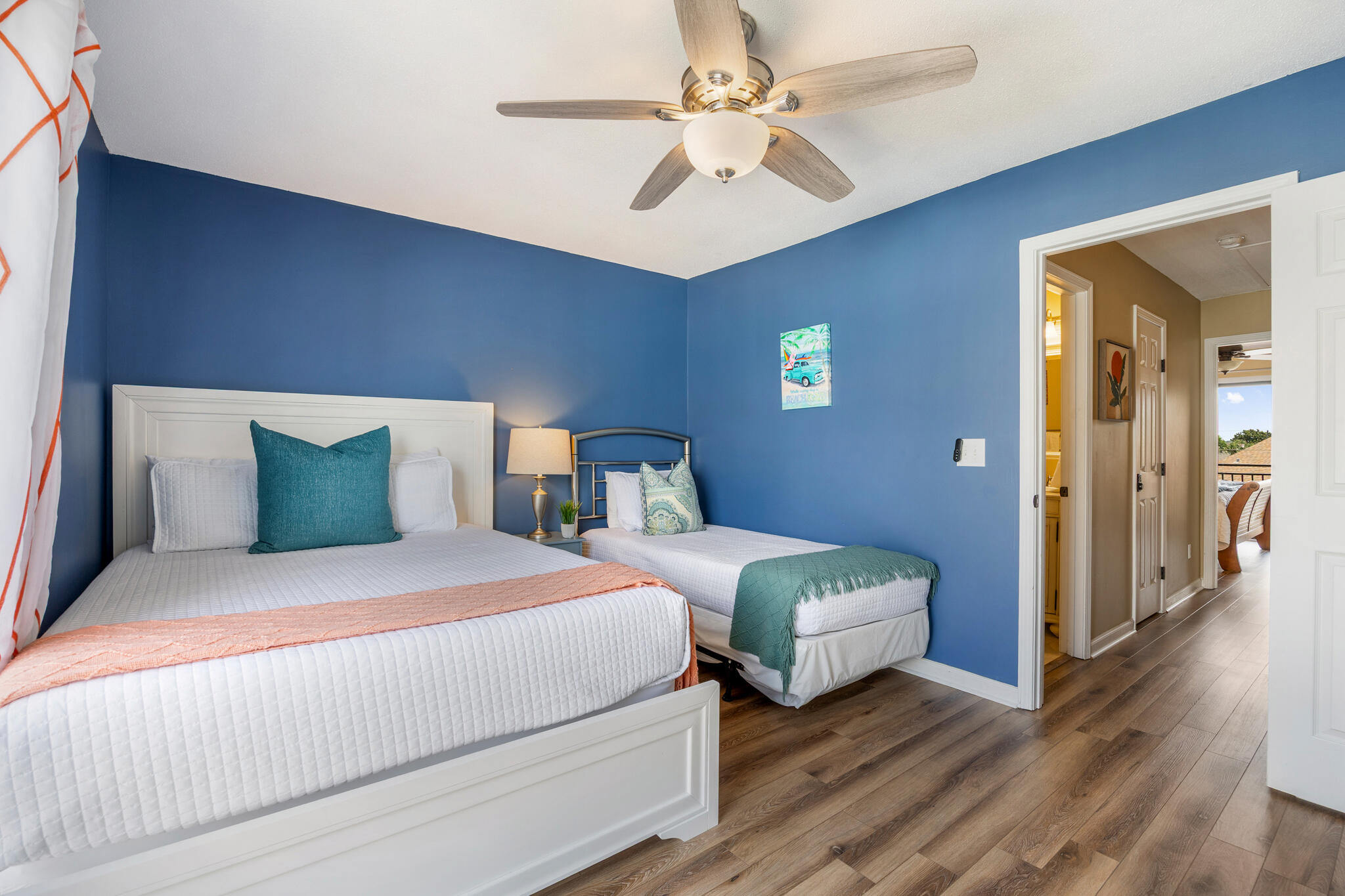 11 Driftwood Road, Unit 2 Miramar Beach, FL 32550 - Photo 28 of 45 a bedroom with a bed and a chandelier