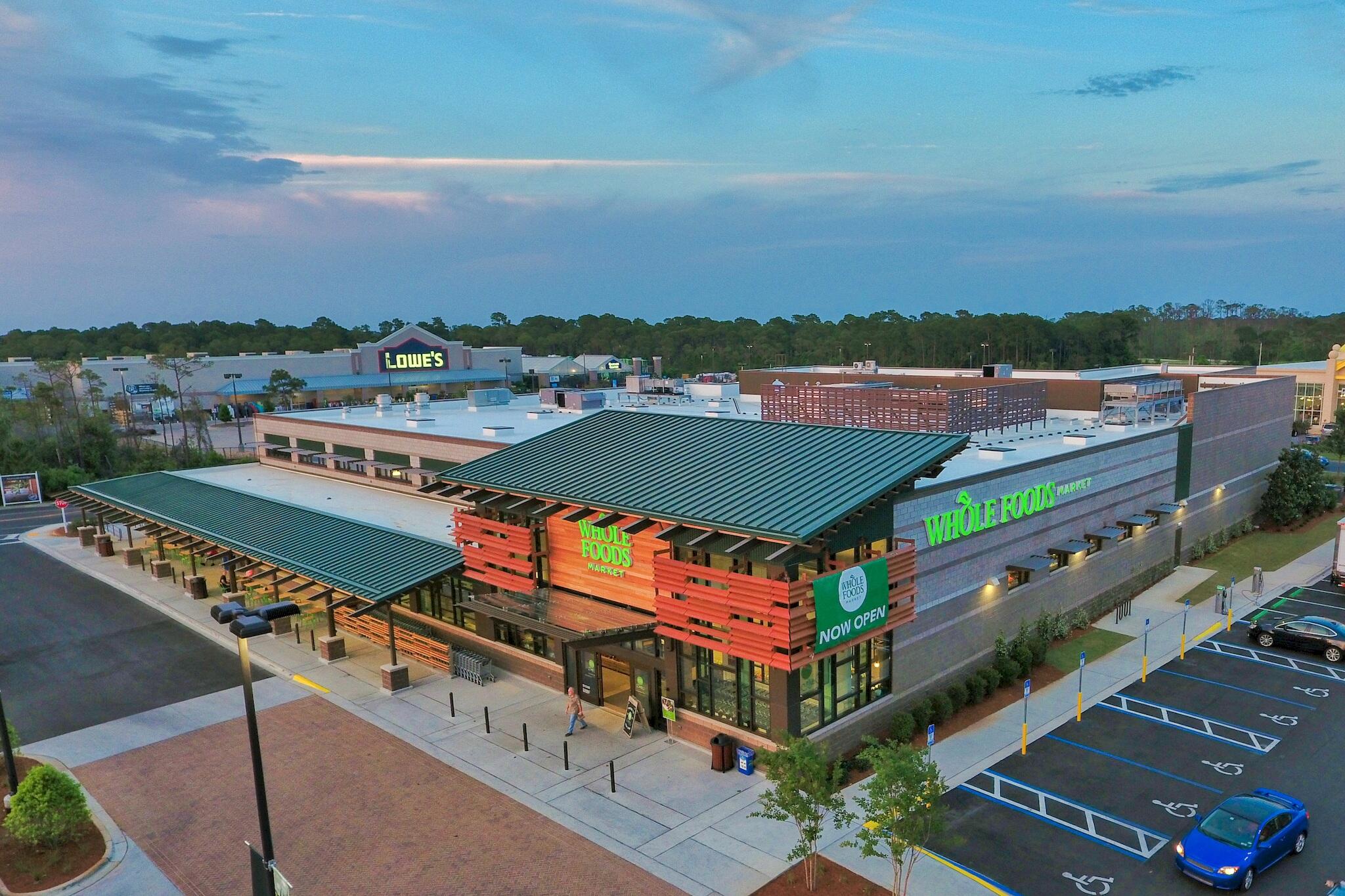 11 Driftwood Road, Unit 2 Miramar Beach, FL 32550 - Photo 41 of 45 an aerial view of a tennis ground and a buildings in the background