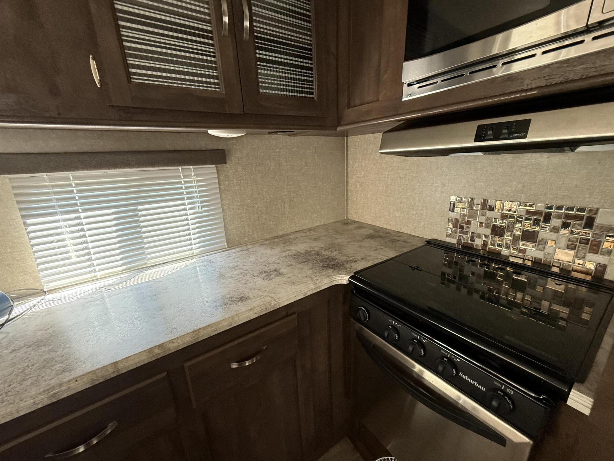 4386 South Laurel Road London, KY 40744 - Photo 18 of 35 Countertop, stove, and backsplash