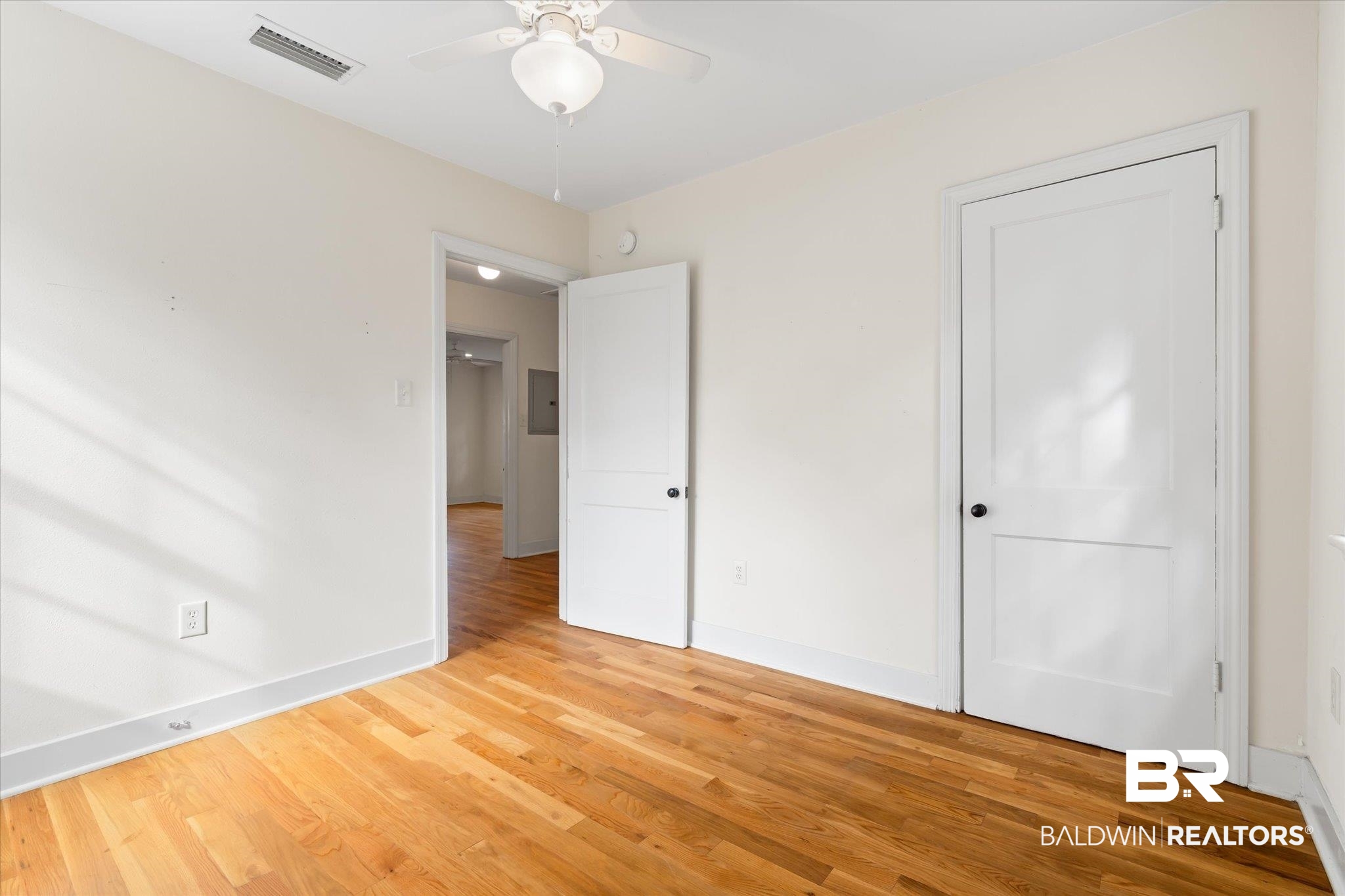 5113 Norton Lane Mobile, AL 36608 - Photo 15 of 20 Unfurnished bedroom featuring ceiling fan and hardwood / wood-style floors