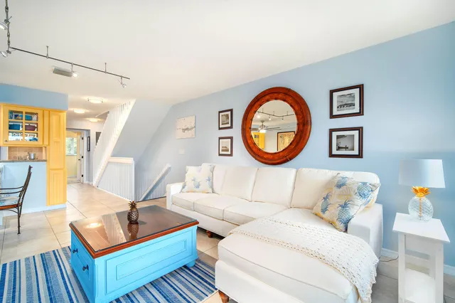 a large kitchen with stainless steel appliances granite countertop a sink and a refrigerator