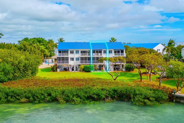 a view of a street with large trees