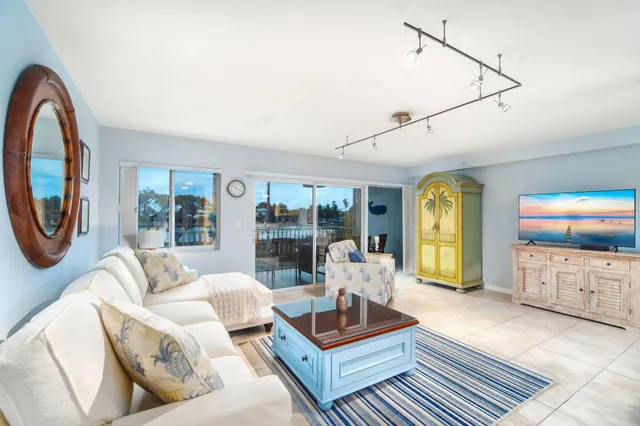 a blue chair sitting in front of a window
