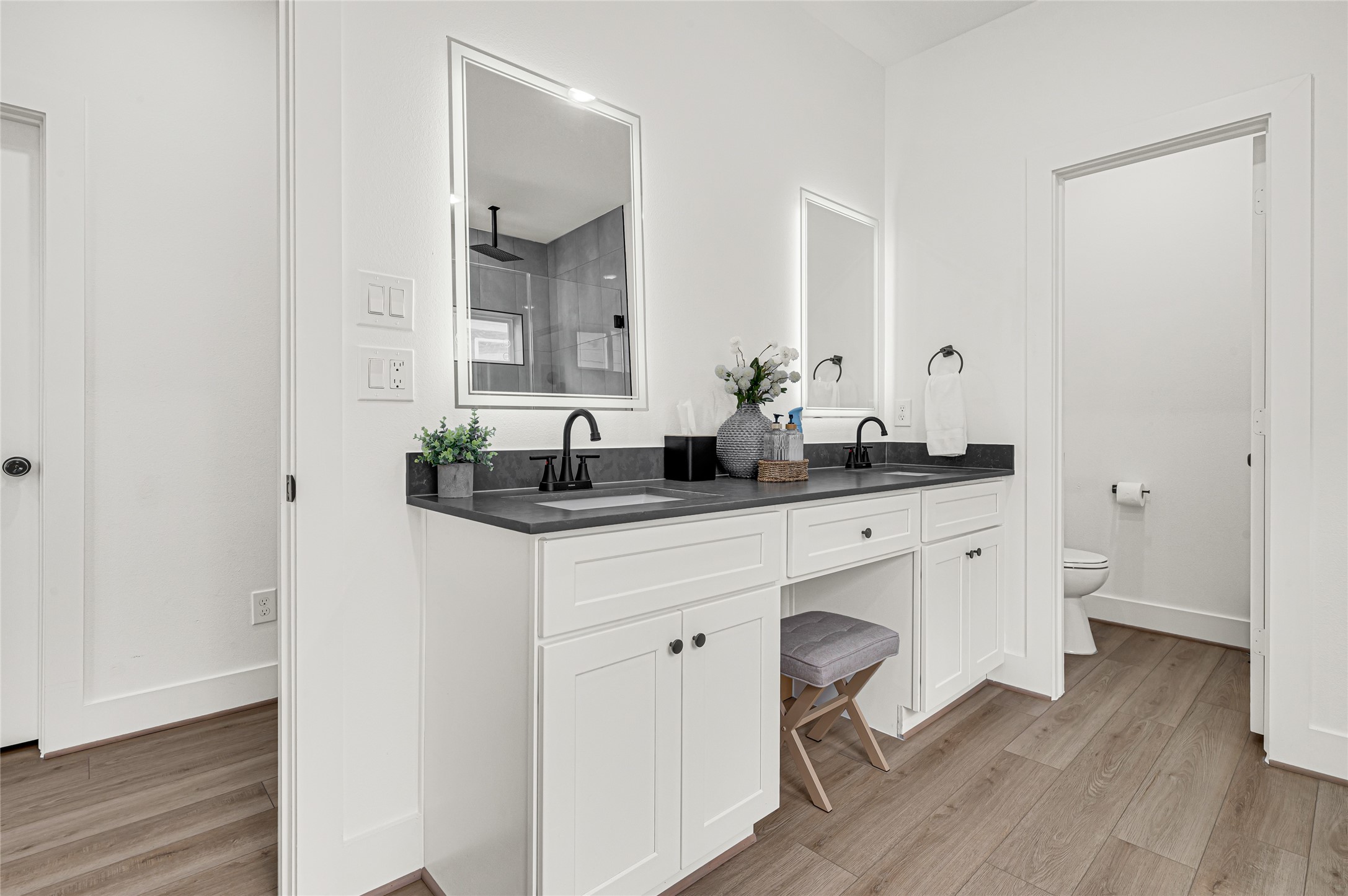 4201 Stassen Street Houston, TX 77051 - Photo 26 of 39 a bathroom with a double vanity sink and mirror