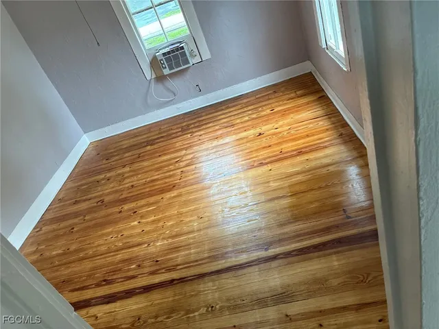 a view of an empty room with stairs
