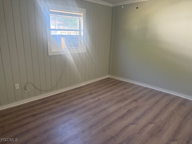 3207 Broadway Fort Myers, FL 33901 - Photo 16 of 25 a view of an empty room with wooden floor and a window