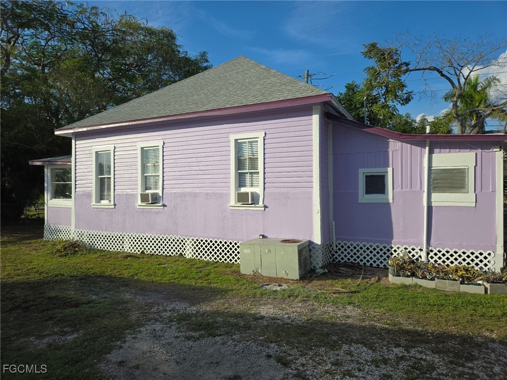 3207 Broadway Fort Myers, FL 33901 - Photo 2 of 25 a front view of a house with a yard