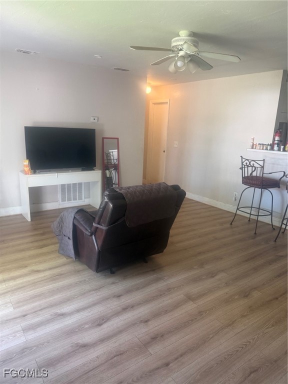 3207 Broadway Fort Myers, FL 33901 - Photo 22 of 25 a living room with furniture and a flat screen tv