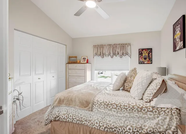 a bedroom with a bed and a dresser