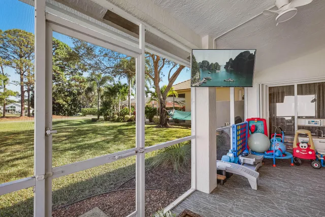 a view of a big yard with large trees