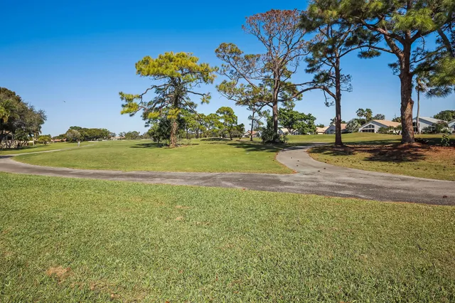 a swimming pool view with a outdoor seating