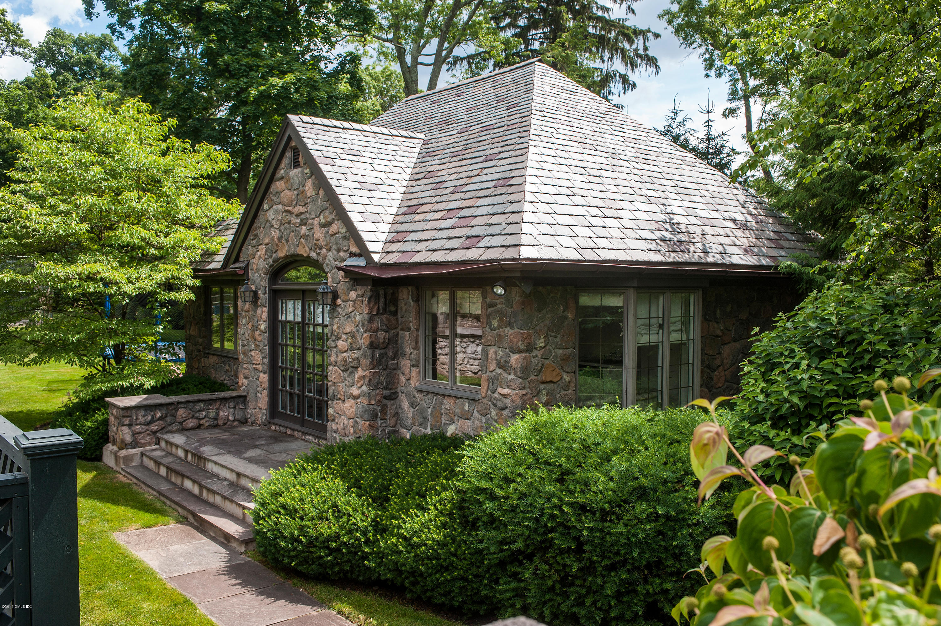 11 Flagler Drive Greenwich, CT 06830 - Photo 16 of 19 a front view of a house with garden