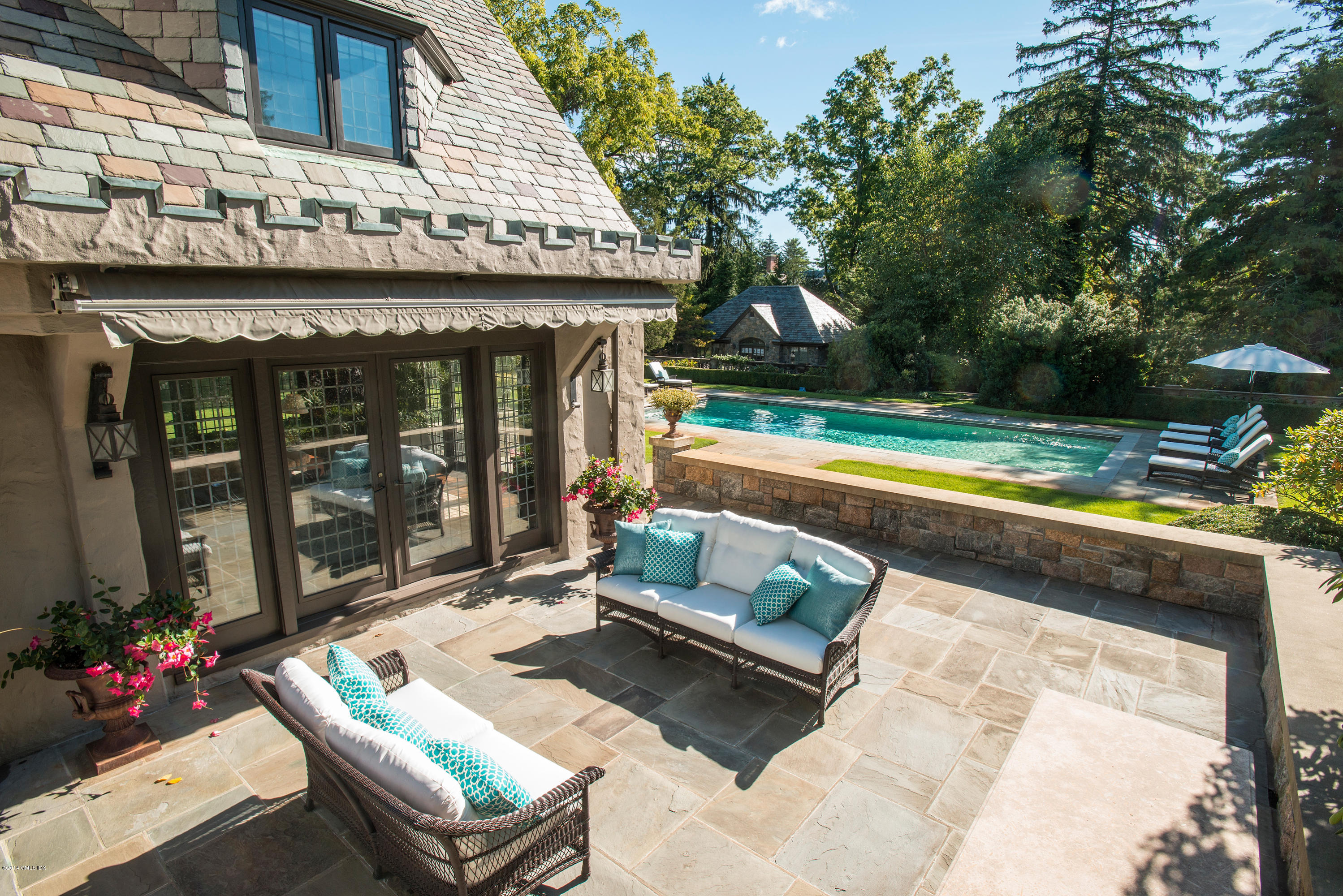 11 Flagler Drive Greenwich, CT 06830 - Photo 18 of 19 a view of a chairs and table in the patio with a swimming pool