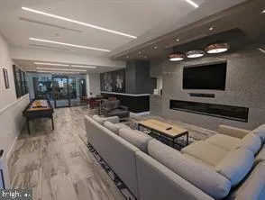 a room with lots of furniture and a large window