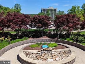 5225 Pooks Hill Road, Unit 1211S Bethesda, MD 20814 - Photo 29 of 32 Serene garden oasis with vibrant trees.