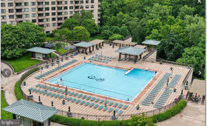 5225 Pooks Hill Road, Unit 1211S Bethesda, MD 20814 - Photo 31 of 32 Serene poolside retreat in nature.