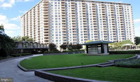 a front view of a building with garden