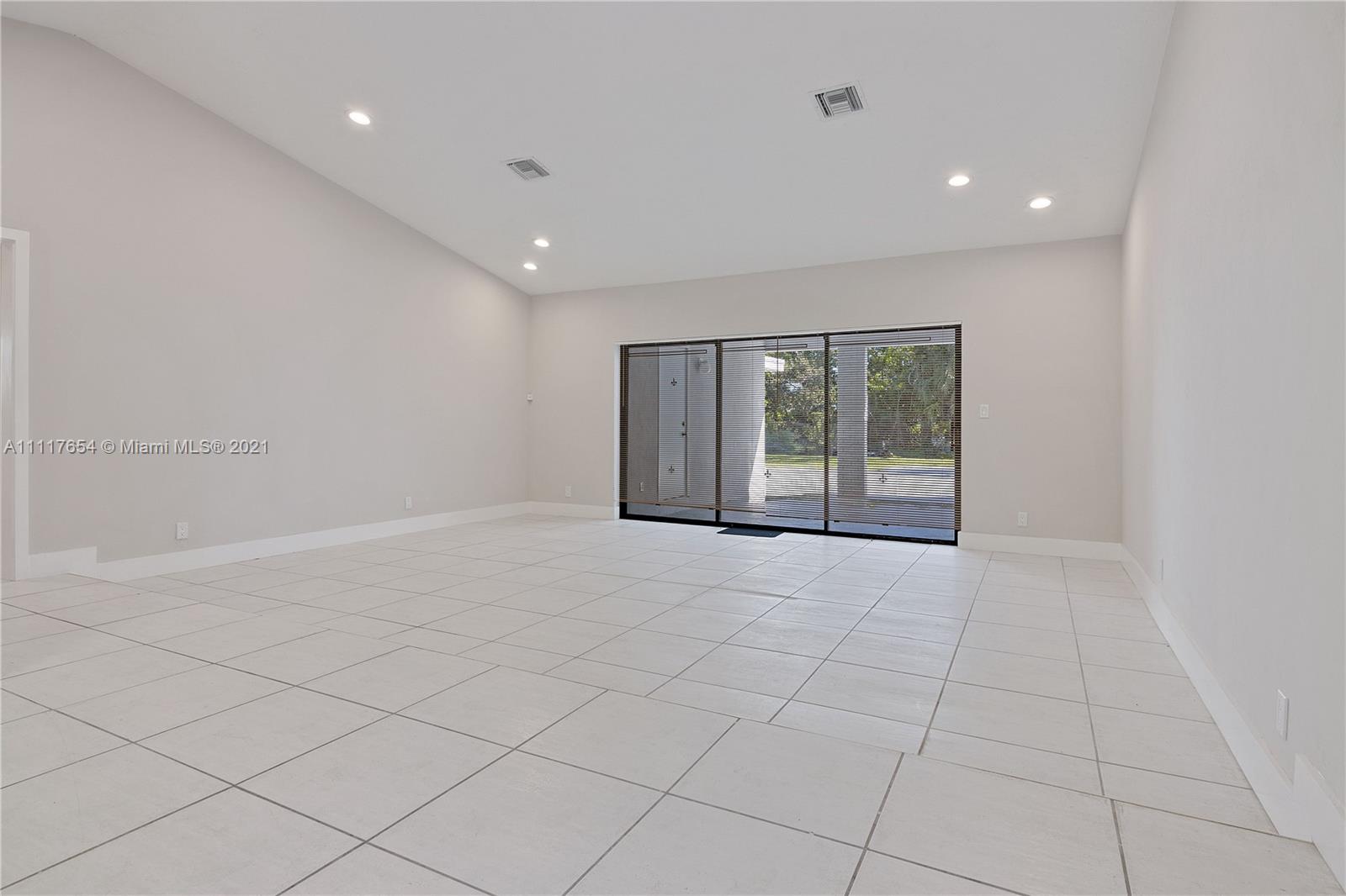 1960 Southwest 51st Terrace Plantation, FL 33317 - Photo 13 of 35 a view of an empty room with a window