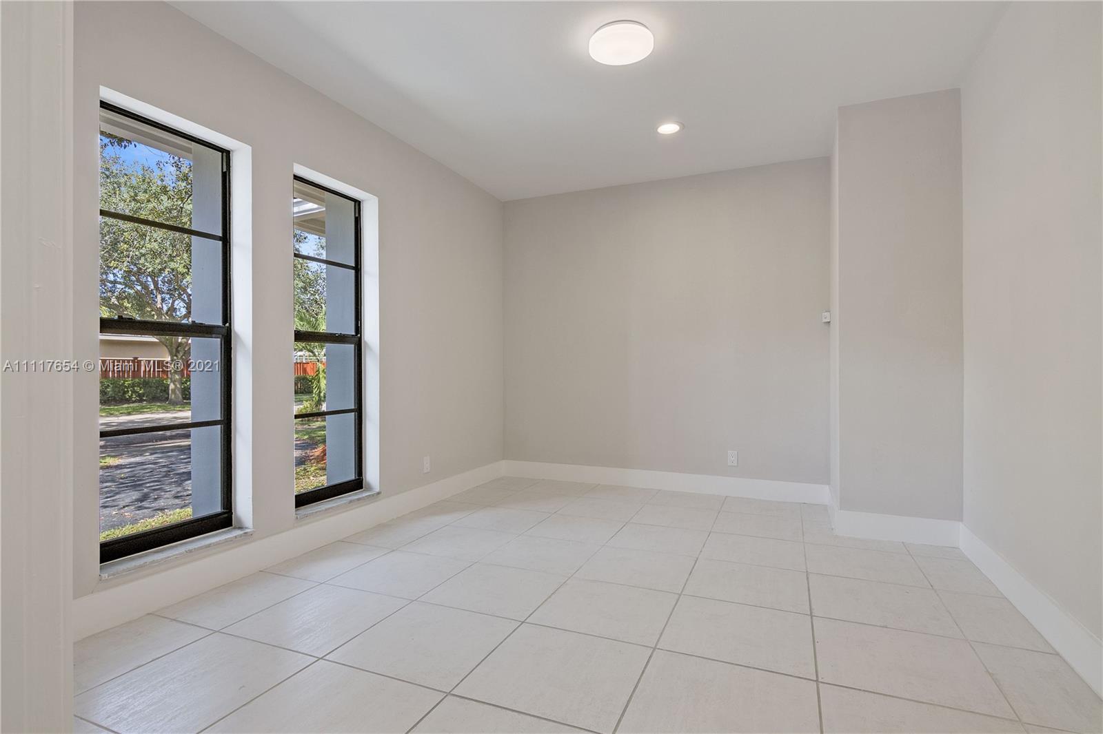 1960 Southwest 51st Terrace Plantation, FL 33317 - Photo 14 of 35 an empty room with windows