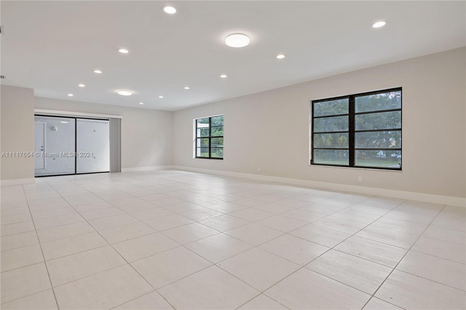 1960 Southwest 51st Terrace Plantation, FL 33317 - Photo 16 of 35 an empty room with windows and closet
