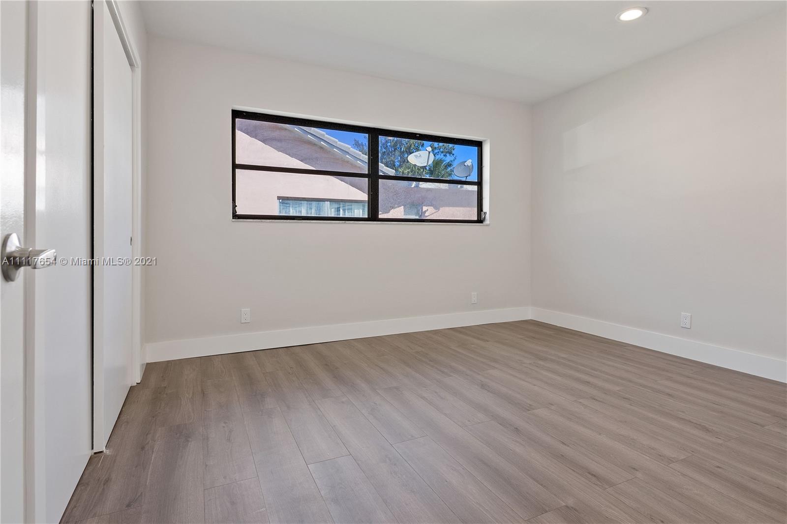 1960 Southwest 51st Terrace Plantation, FL 33317 - Photo 23 of 35 wooden floor in an empty room