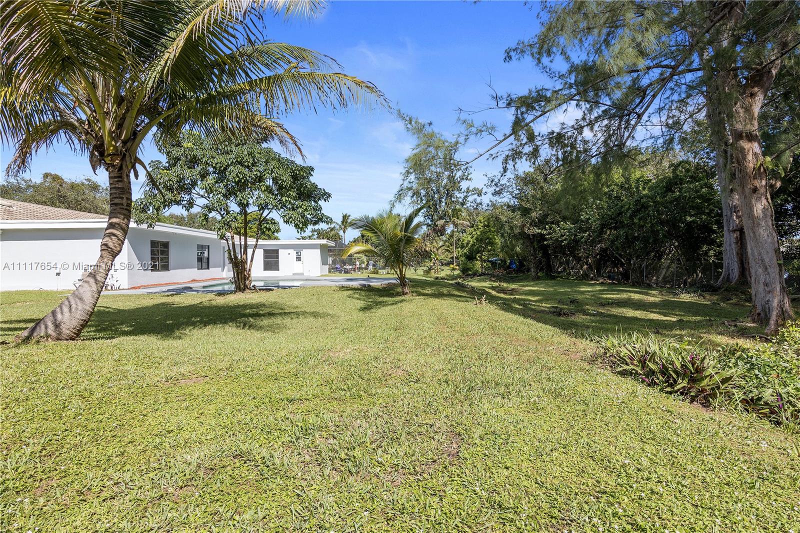 1960 Southwest 51st Terrace Plantation, FL 33317 - Photo 30 of 35 a view of a house with swimming pool