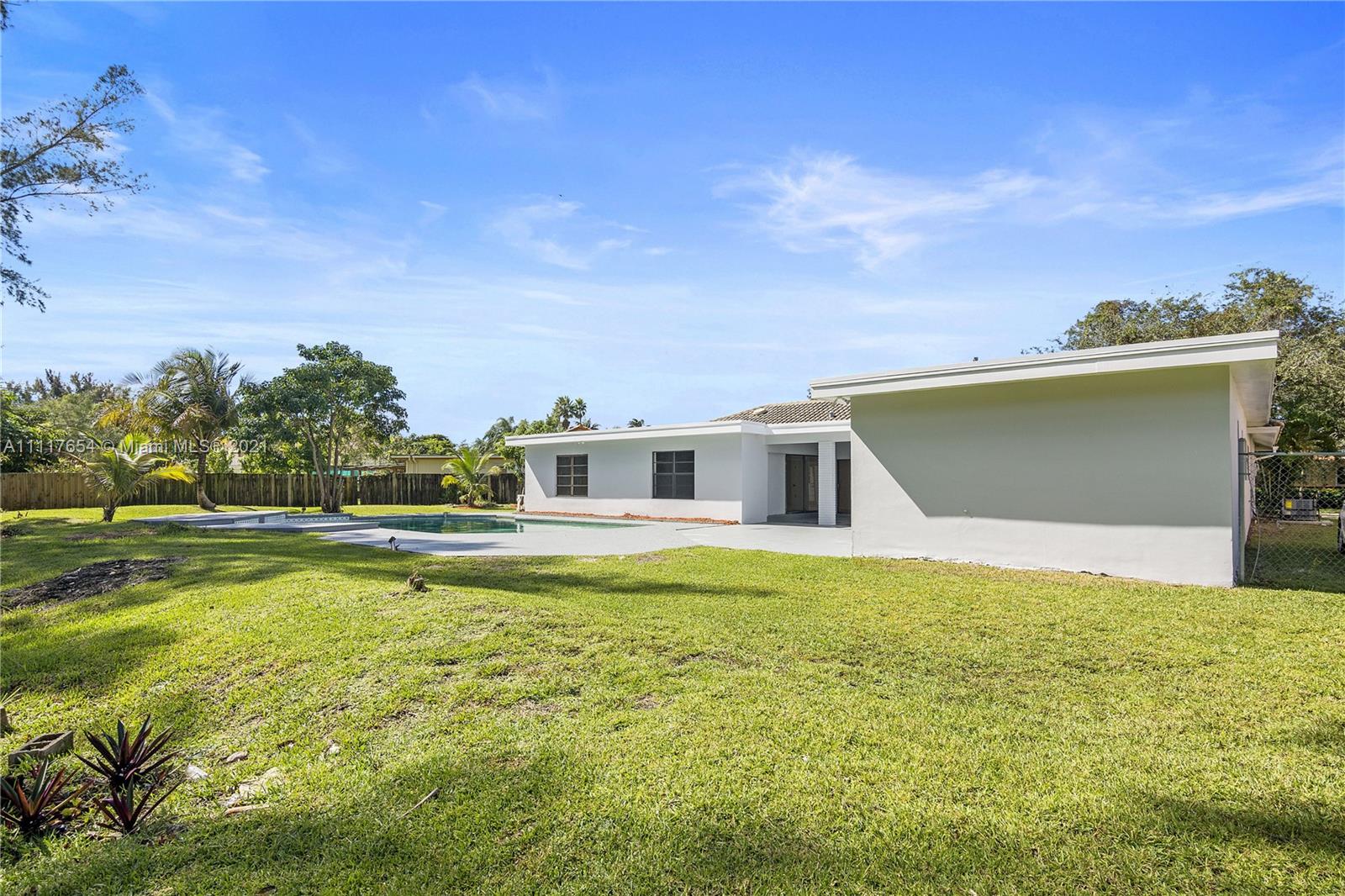 1960 Southwest 51st Terrace Plantation, FL 33317 - Photo 31 of 35 a view of a house with a yard