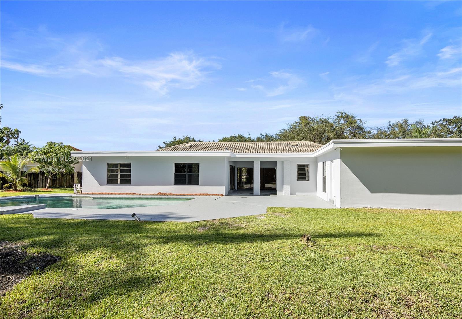 1960 Southwest 51st Terrace Plantation, FL 33317 - Photo 33 of 35 a front view of a house with a garden and yard