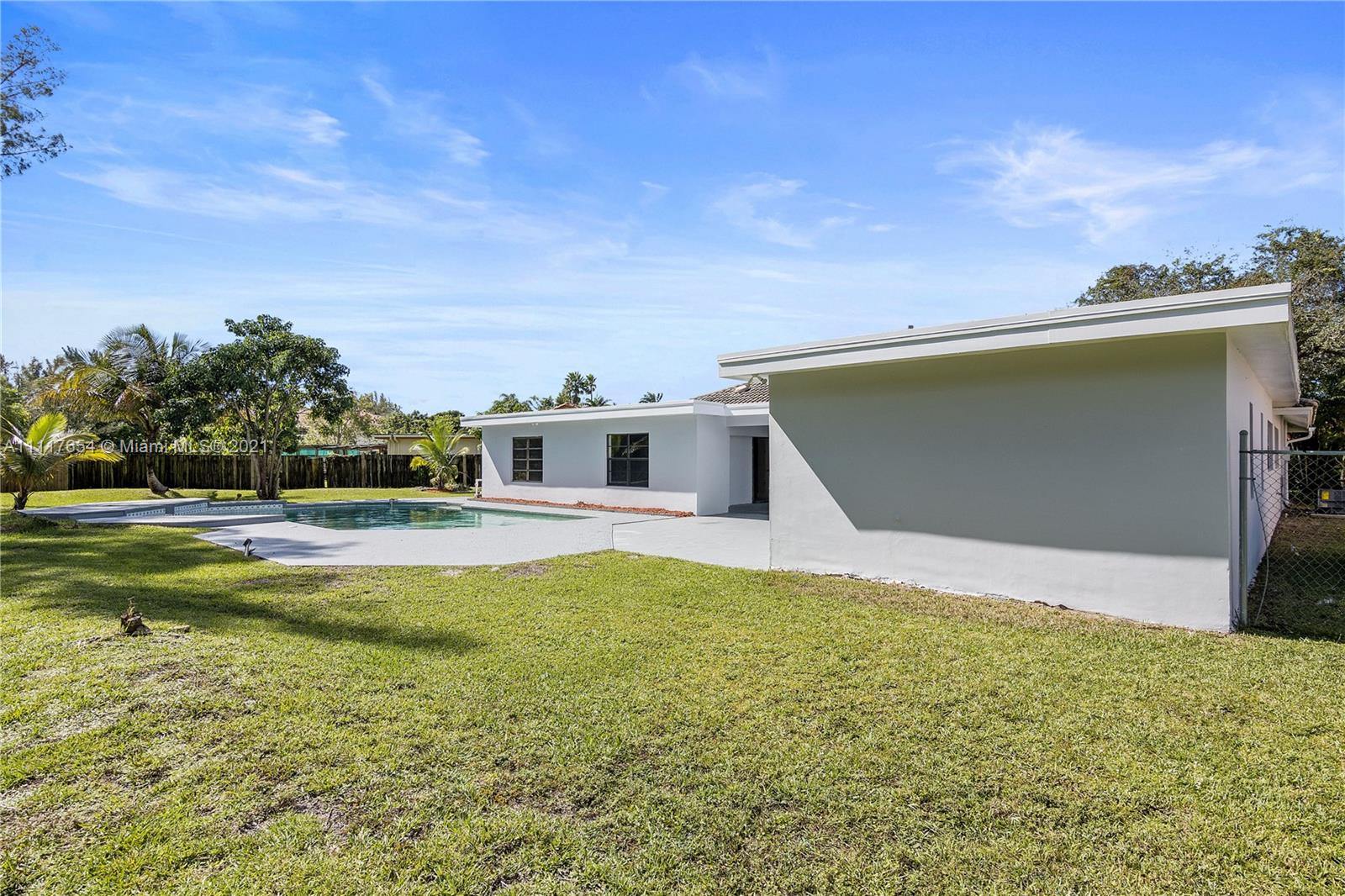1960 Southwest 51st Terrace Plantation, FL 33317 - Photo 34 of 35 a house view with swimming pool in front of it