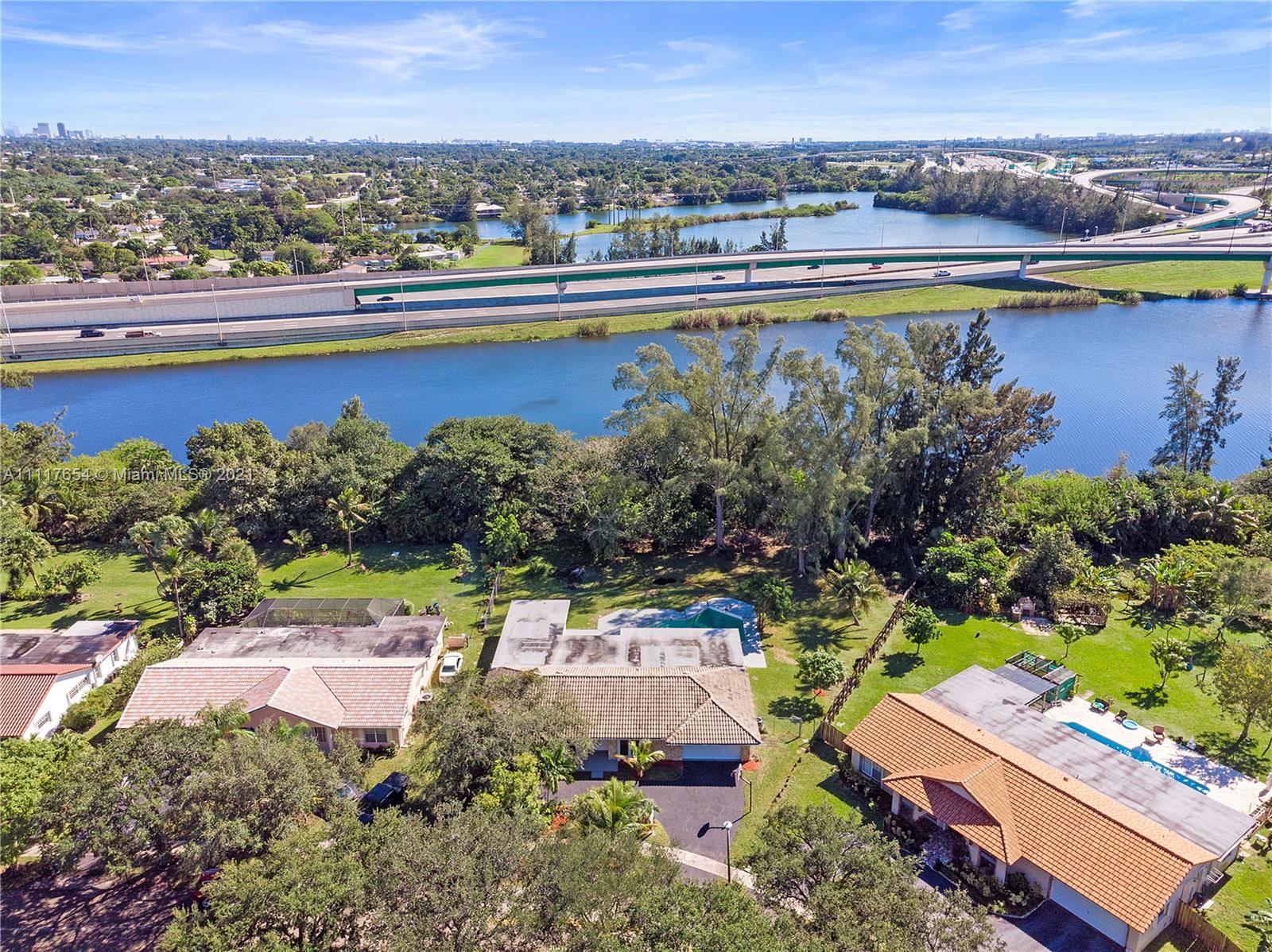 1960 Southwest 51st Terrace Plantation, FL 33317 - Photo 9 of 35 an aerial view of a house with a lake view