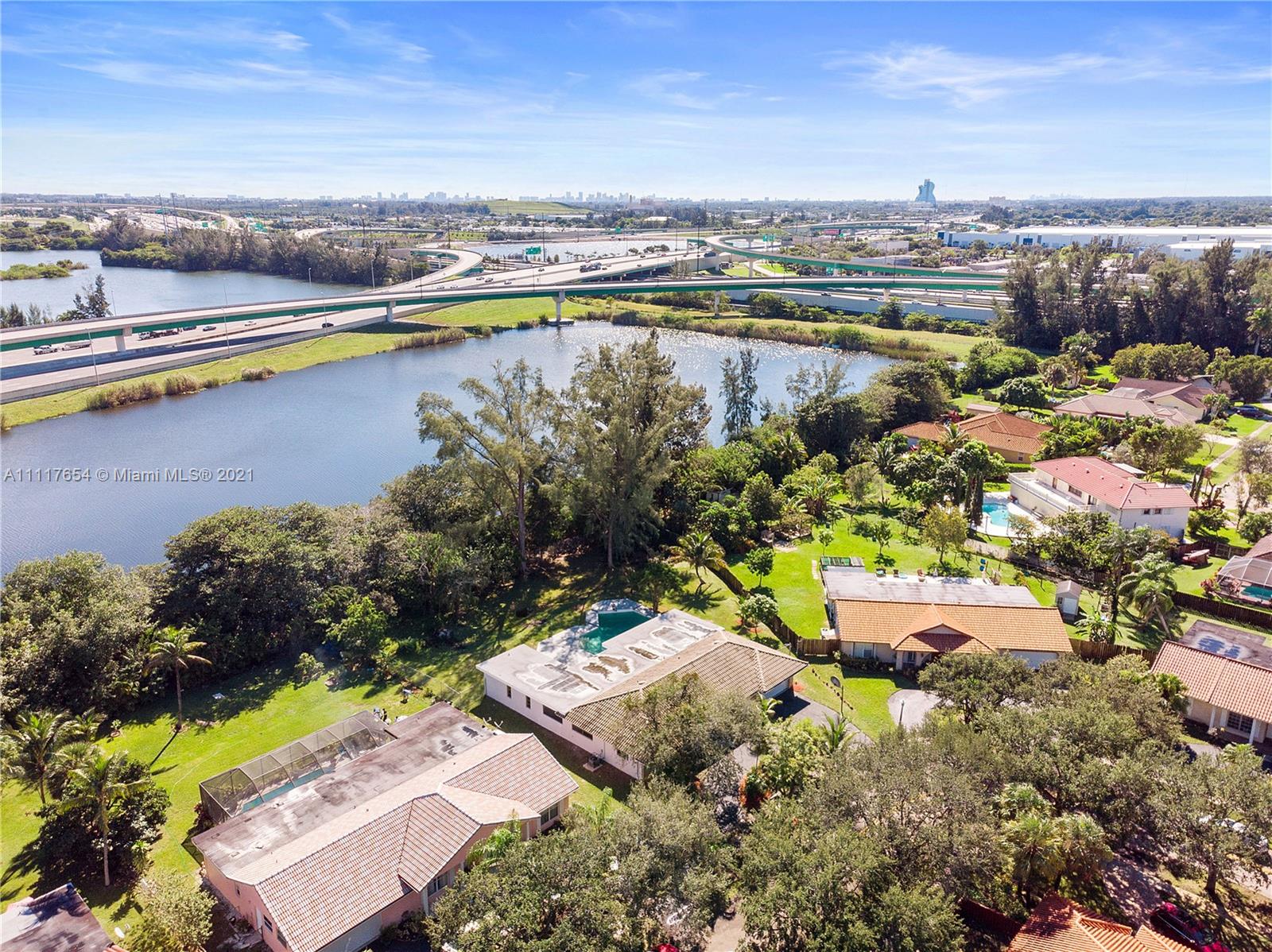 1960 Southwest 51st Terrace Plantation, FL 33317 - Photo 10 of 35 an aerial view of residential houses with outdoor space and swimming pool