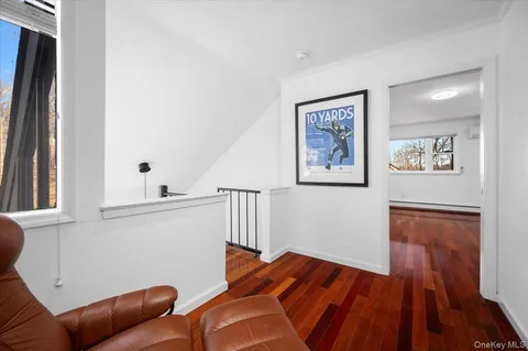 a workspace with wooden floor and furniture