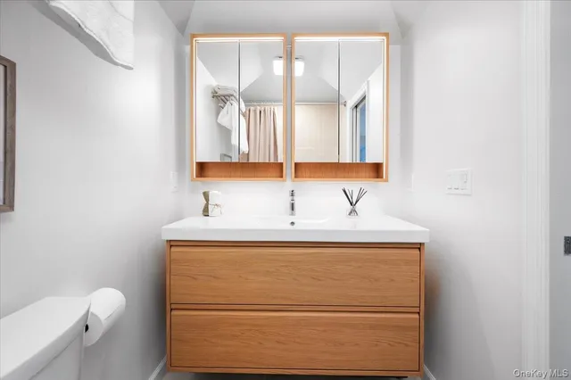 a bathroom with a sink and a vanity