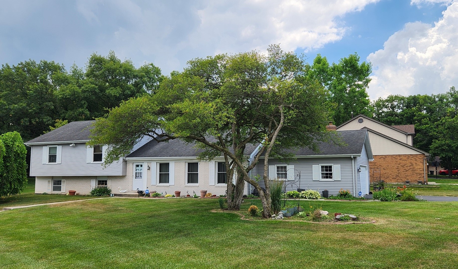 3614 Arthur Road Crete, IL 60417 - Photo 15 of 15 a front view of a house with a yard and trees