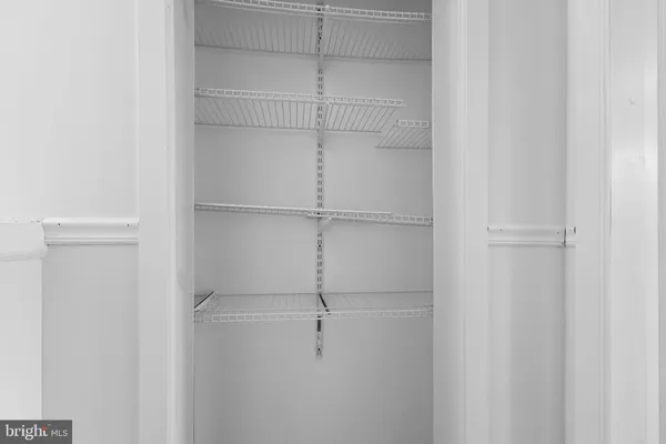 a bathroom with a granite countertop bathtub shower sink and toilet
