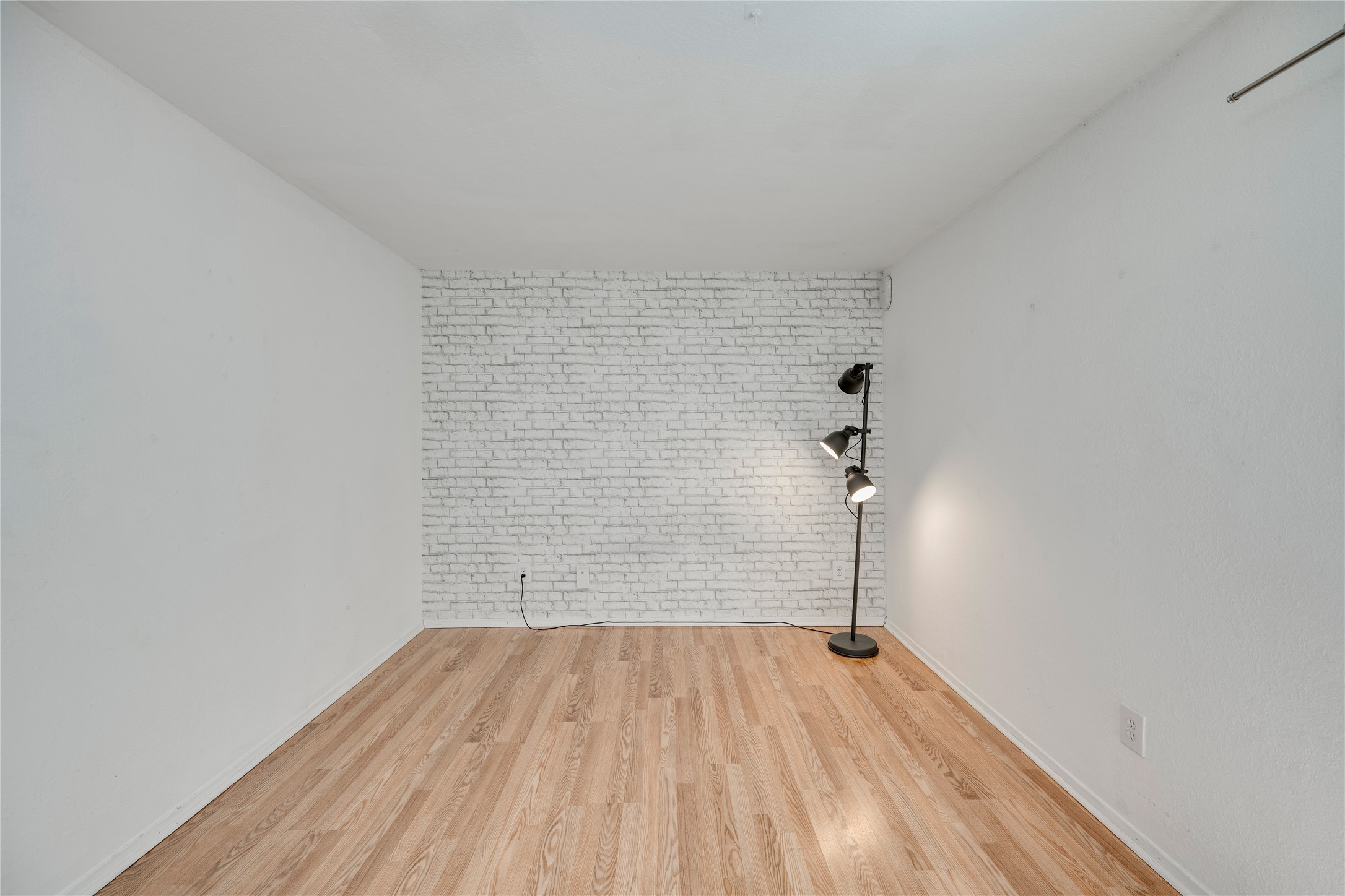 3627 Menchaca Road, Unit 108 Austin, TX 78704 - Photo 2 of 24 Smooth wood floors and a clean layout highlight this versatile interior space.