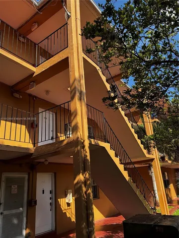 a view of a house with a tree