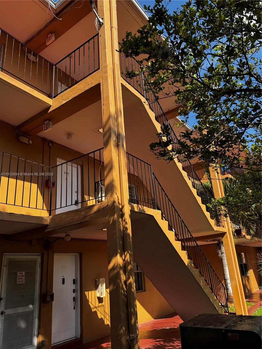 1330 West 54th Street, Unit 205C Hialeah, FL 33012 - Photo 1 of 10 a view of a house with a tree