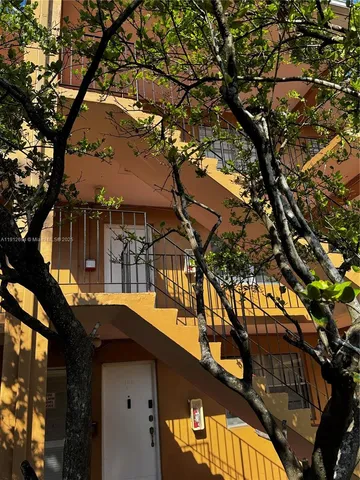 a house view with a tree