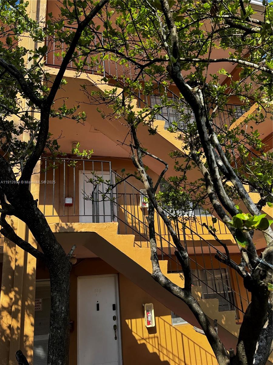 1330 West 54th Street, Unit 205C Hialeah, FL 33012 - Photo 9 of 10 a house view with a tree