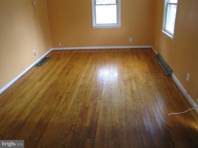 4607 Morgan Road Morningside, MD 20746 - Photo 8 of 13 a view of a room with wooden floor and brick walls
