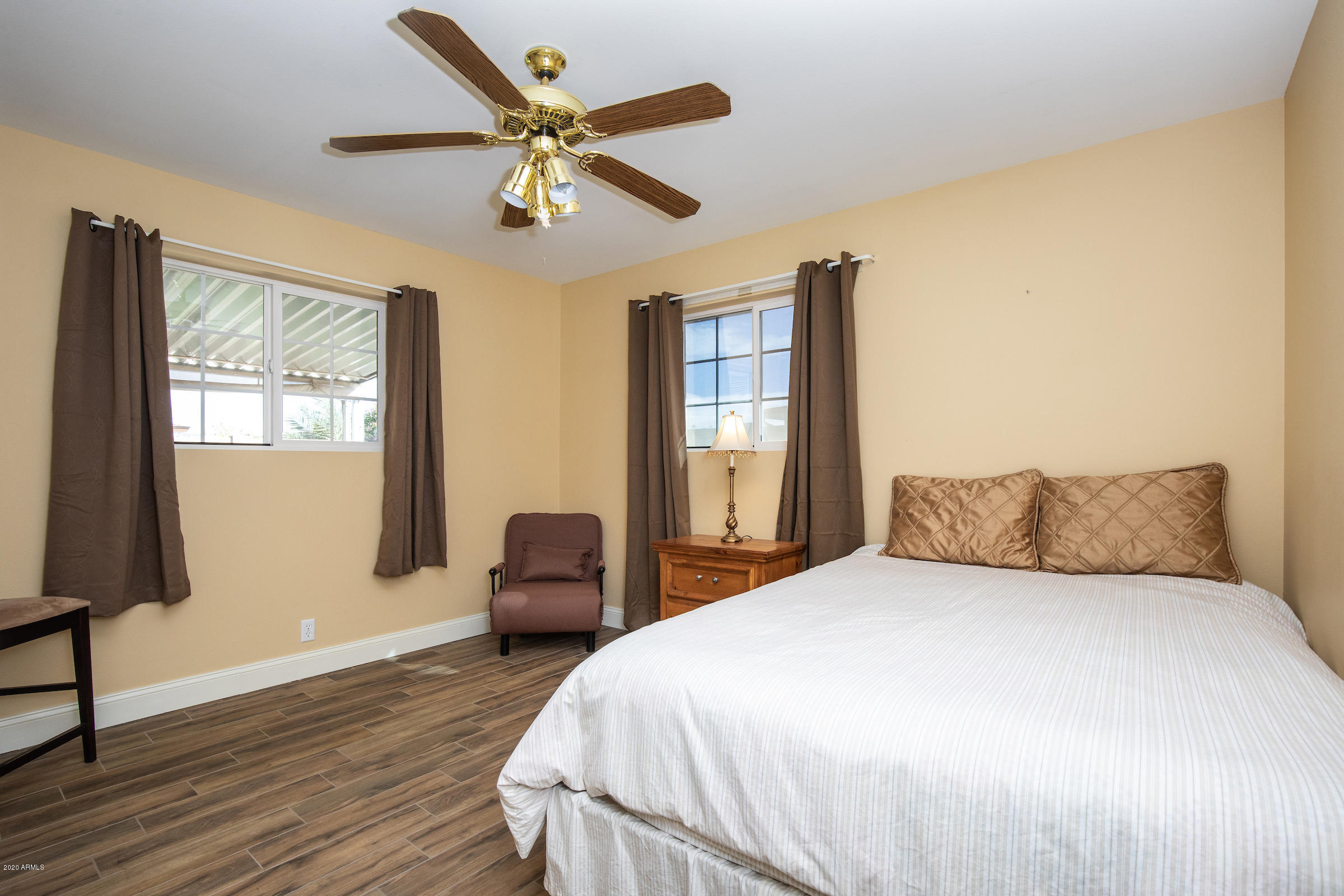5320 East Decatur Street Mesa, AZ 85205 - Photo 20 of 34 a bedroom with a large bed and a window