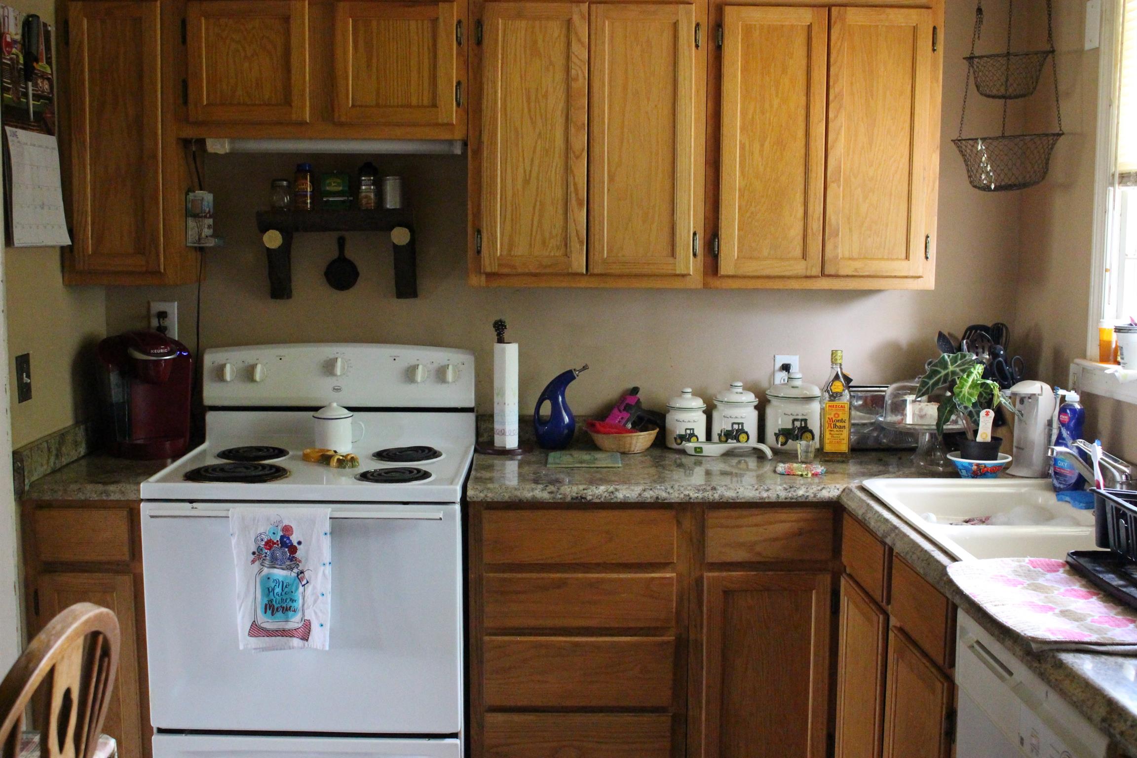 3676 Dobbin Road Springfield, TN 37172 - Photo 3 of 9 a kitchen with stainless steel appliances granite countertop a sink stove and cabinets
