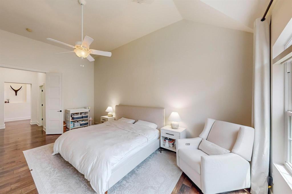 9964 Madrone Drive Frisco, TX 75033 - Photo 16 of 39 a bedroom with a bed and a chandelier