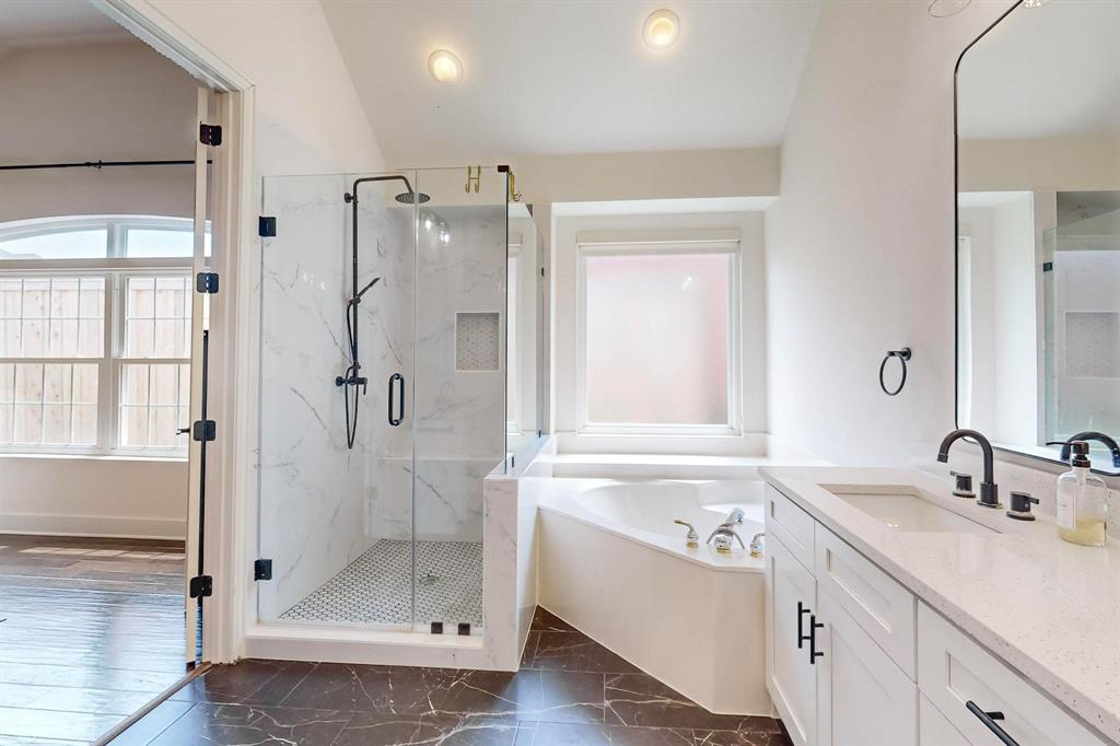 9964 Madrone Drive Frisco, TX 75033 - Photo 19 of 39 a bathroom with a granite countertop sink mirror and shower